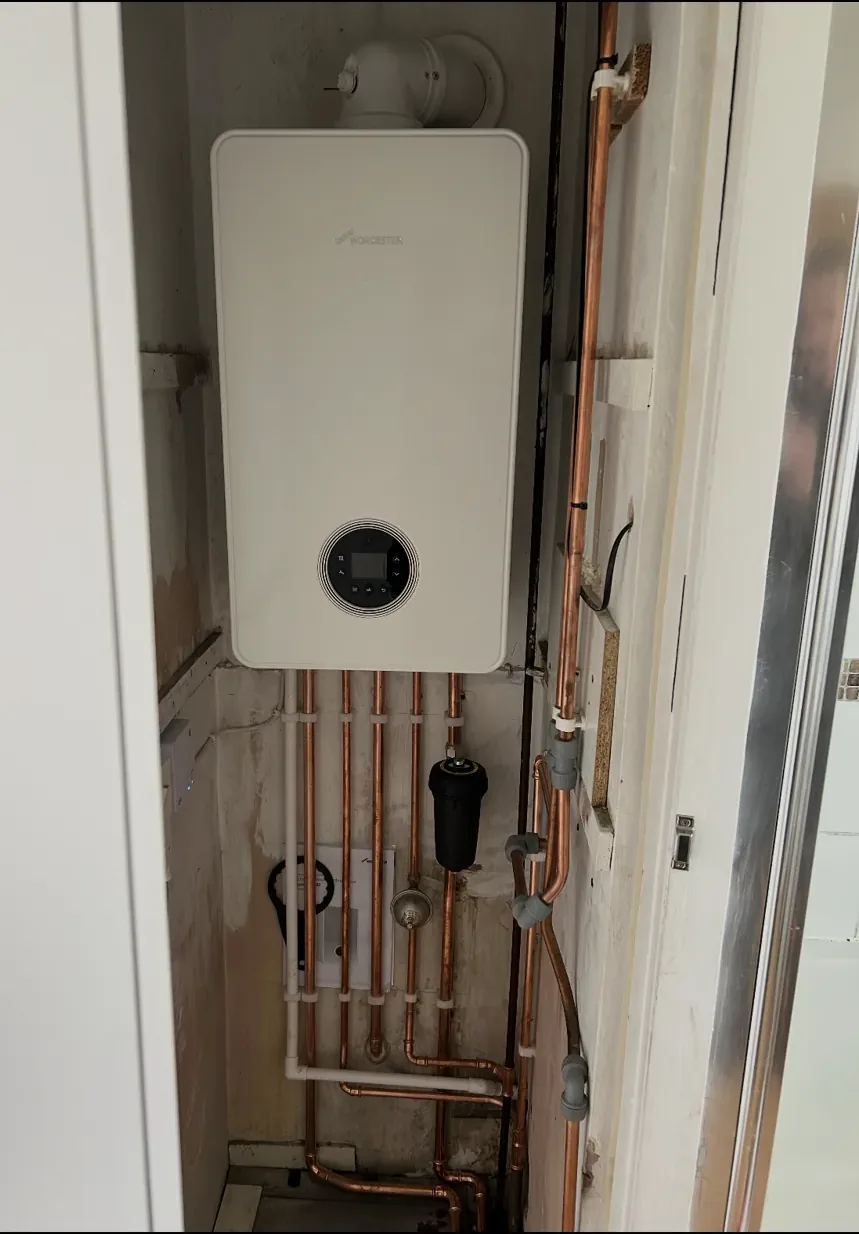 Wall-mounted combi boiler installation in Hampshire