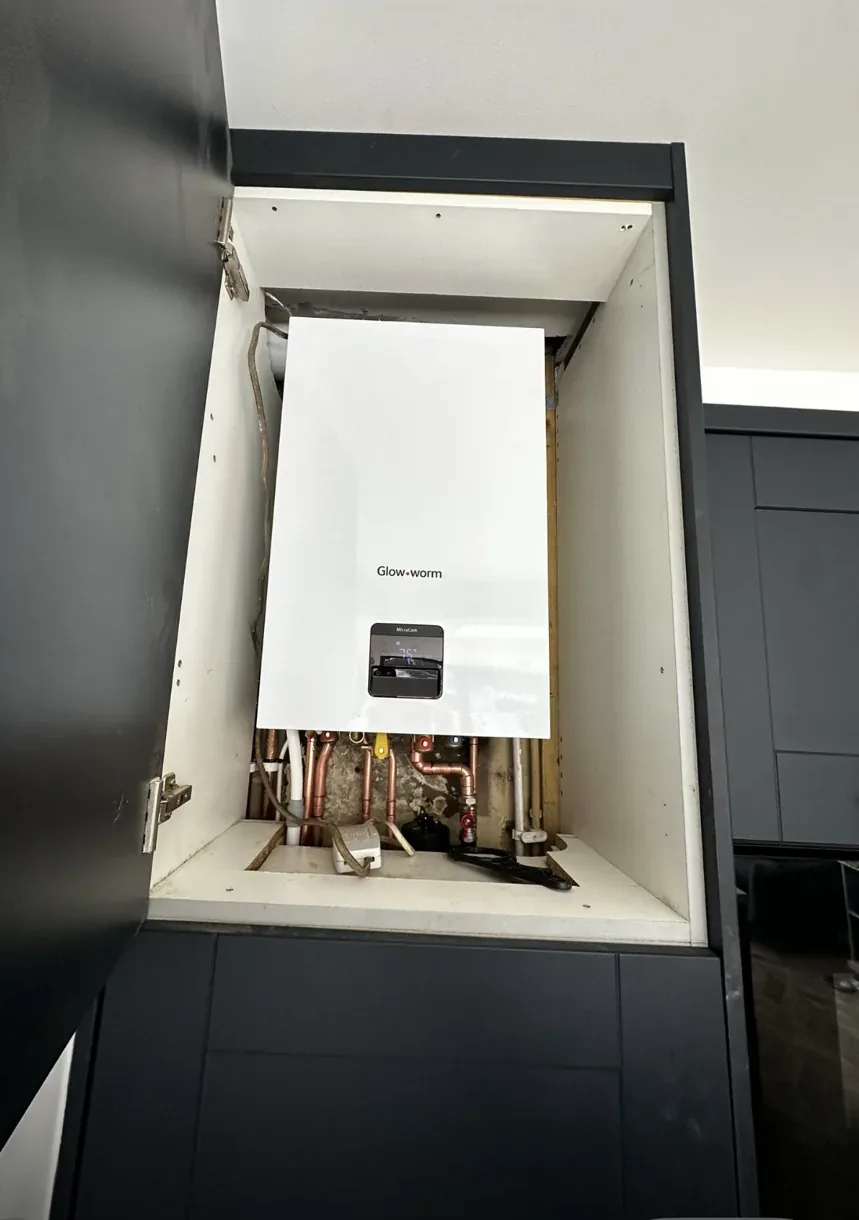 Neat boiler pipework and controls after installation