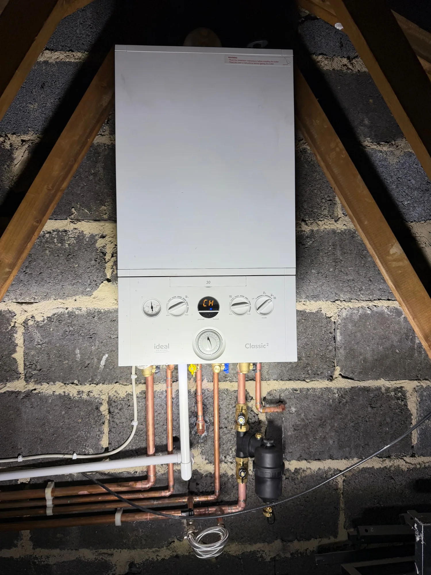 Ideal boiler and pipework installed by PHG in a loft